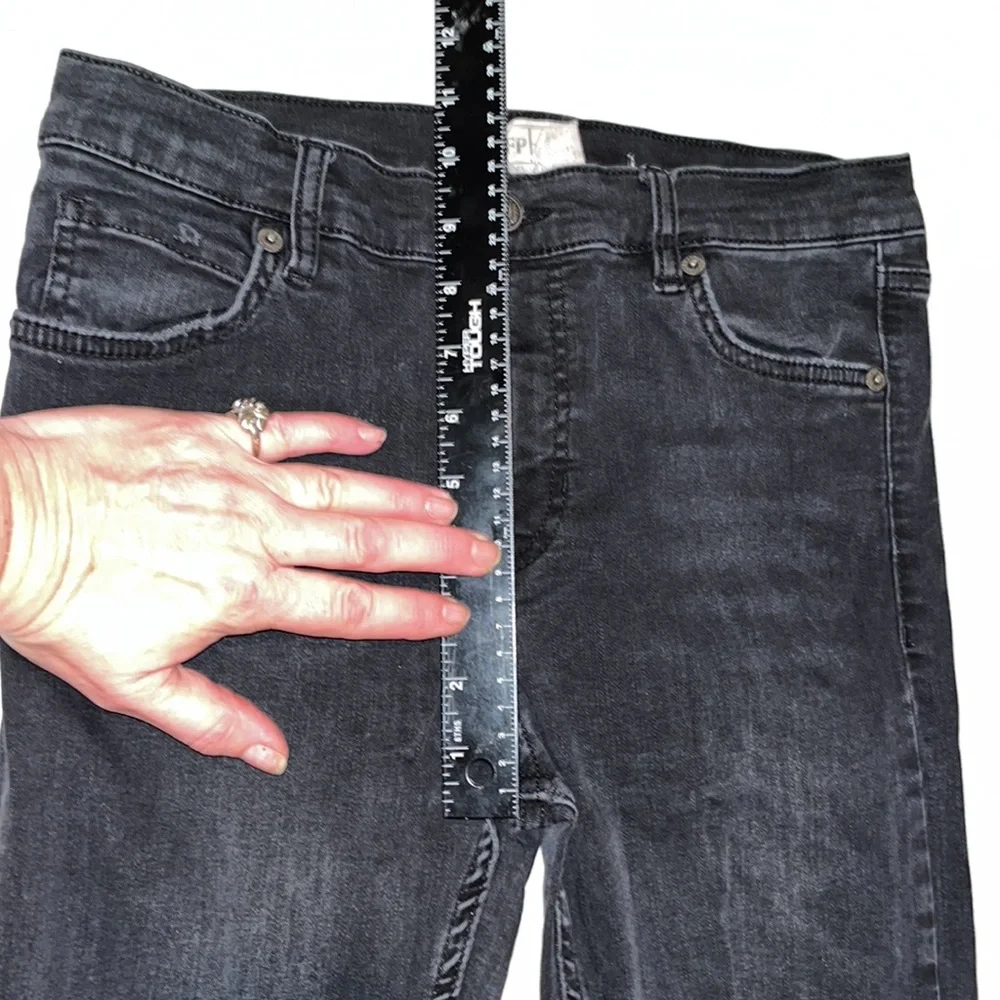 Free People size 27 Black Wash skinny jeans distressed with raw hem